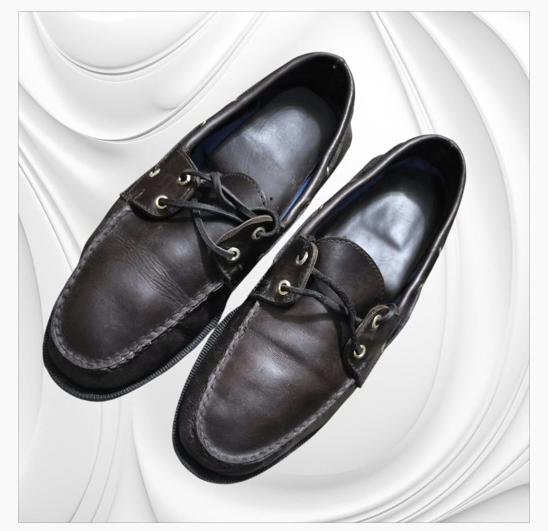Sperry Boat Shoes (Category: Casual Shoes) located in Paranaque City. Submitted by calm_youngstore7 (Listing ID 1467702274, Image 1). Description: Sperry Men's Authentic Original 2-Eye Boat Shoes. These timeless dark brown leather deck shoes feature traditional hand-sewn moccasin construction, functional 360° rawhide lacing system with metallic eyelets, and non-marking rubber outsoles designed for premium wet/dry traction. Sperry Authentic Origin