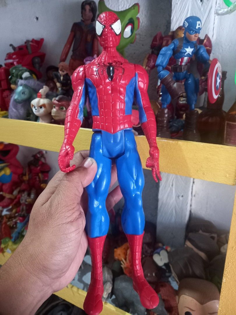 Spider-Man Action Figure Toy (Category: Figurines & Statues) located in Manila. Submitted by cristobalc40322 (Listing ID 1467624353, Image 2). Description: - Classic red and blue Spider-Man action figure - Detailed web pattern with white eyes and black chest symbol - Fully poseable arms and legs for dynamic displays - Perfect addition to any toy collection or Marvel fan shelf VERY GOOD CONDITION AS IS HASBRO 2013 11½" & 5" INCHES 2 for 270php LOC