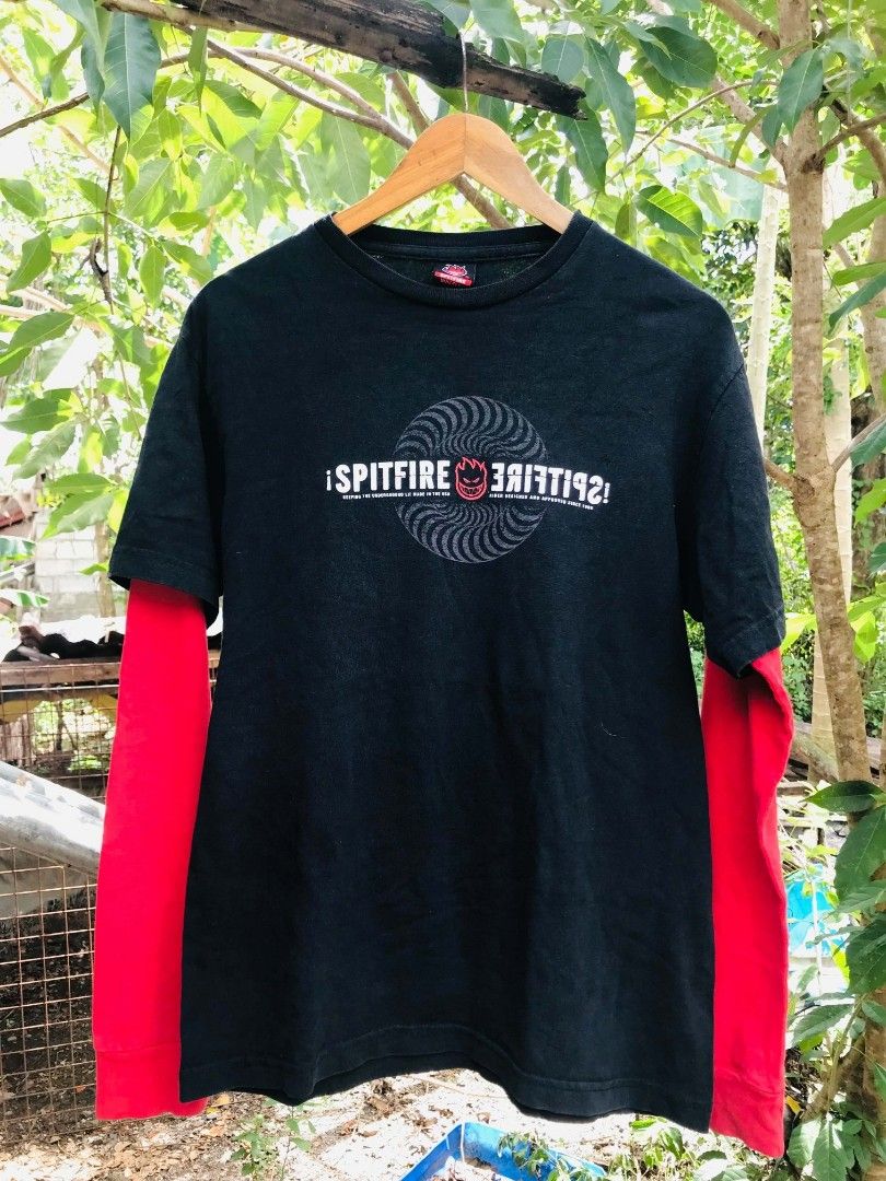 Spitfire Wheels Double Layer Long Sleeve T-Shirt Black Red (Category: Tshirts & Polo Shirts ) located in Camiling. Submitted by dinurobongtubol (Listing ID 1467651775, Image 1). Description: - Brand: Spitfire Wheels - Design: Black short sleeve tee with red layered long sleeves - Graphics: Big white and red swirl logo on chest, smaller logo on upper back - Details: Spitfire inner collar branding tag - Material: Comfortable, high-quality cotton - 