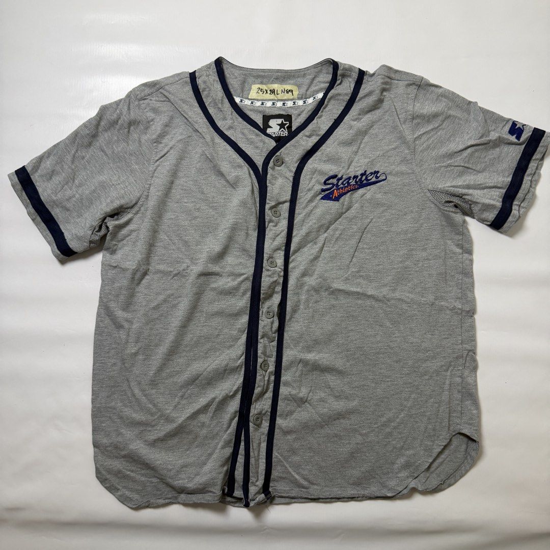 Starter Athletics Grey Baseball Jersey Shirt (Category: Activewear) located in Gapan. Submitted by rasthriftshop (Listing ID 1467797085, Image 1). Description: STARTER Size on tag: L Dimes: 25 x 29 ₱600 + sf Condition: Excellent Color rate: 9/10 Issue: None.
