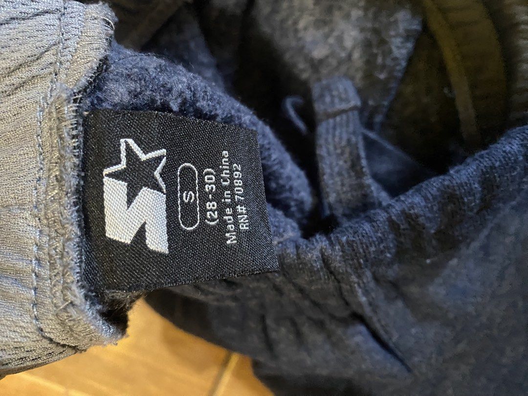 Starter Navy Blue Sweatpants Size S (28-30) (Category: Joggers) located in Talisay. Submitted by rjthriftfinds (Listing ID 1467724934, Image 3). Description: - Brand: Starter - Color: Navy Blue - Size: Small (Fits waist 28 to 30) - Material: Comfortable fleece lining inside - Features: Elastic waistband with adjustable drawstring, two side pockets, and embroidered star logo on the left hip - Condition: Good casual pants for lounging or workouts -
