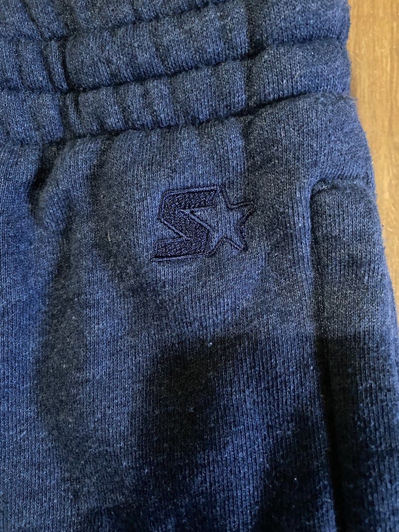 Starter Navy Blue Sweatpants Size S (28-30) (Category: Joggers) located in Talisay. Submitted by rjthriftfinds (Listing ID 1467724934, Image 2). Description: - Brand: Starter - Color: Navy Blue - Size: Small (Fits waist 28 to 30) - Material: Comfortable fleece lining inside - Features: Elastic waistband with adjustable drawstring, two side pockets, and embroidered star logo on the left hip - Condition: Good casual pants for lounging or workouts -