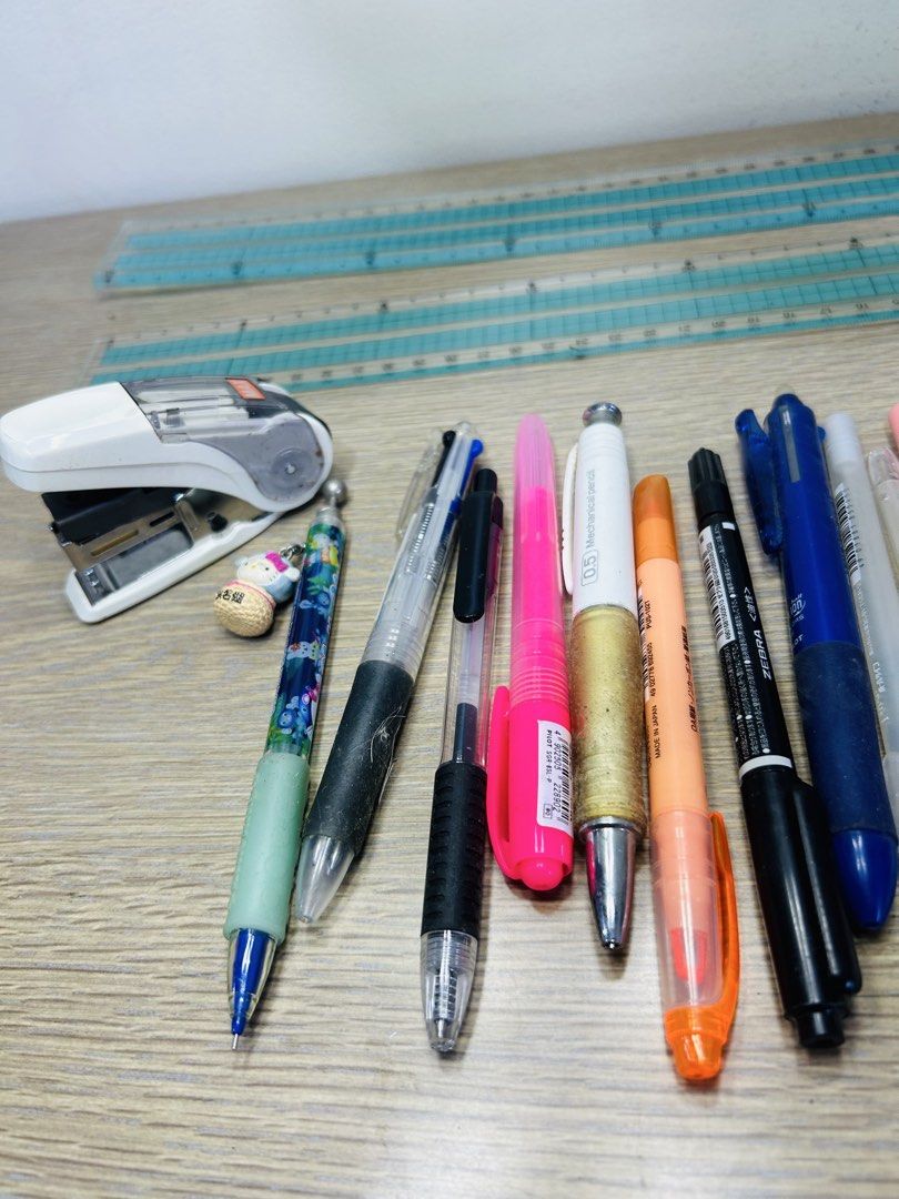 Stationery bundle with pens, stapler, ruler and magnifying glass (Category: Stationery & School Supplies) located in Manila. Submitted by starbalesukandjapansurplus (Listing ID 1467666548, Image 2). Description: Clearing out some desk items. Bundle includes a white stapler, various pens including Zebra and Pilot, clear rulers, and a black folding magnifying glass. All items show some signs of previous handling and normal wear. Selling everything 