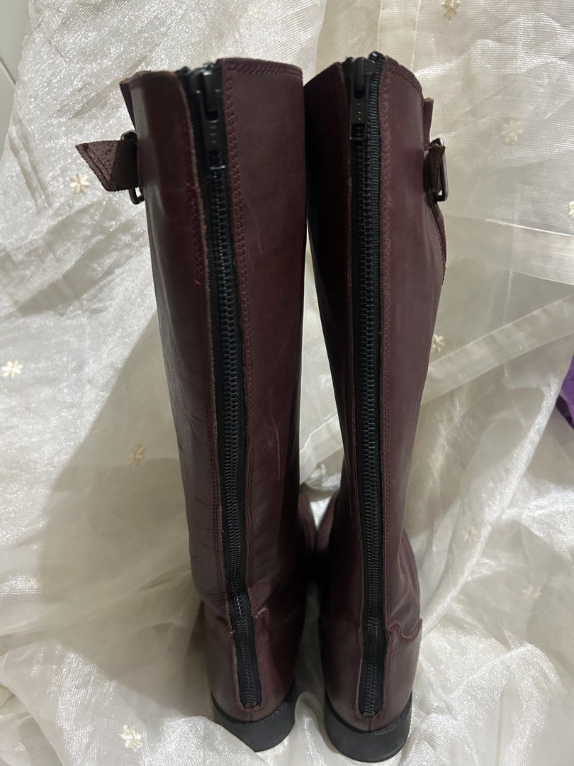 Steve Madden TRROTT Leather Knee-High Boots (Category: Boots) located in Tuguegarao City. Submitted by eliwyxzs (Listing ID 1467705334, Image 3). Description: - Brand/Model: Steve Madden TRROTT Tall Boots - Color/Material: Deep Burgundy Genuine Leather Upper, Rubber Sole - Size: 9 - Origin: Made in Mexico - Closure & Details: Full zipper down the back for easy slip-on, side buckle accent near the top - Condition: Minor scuffs on the toe area from