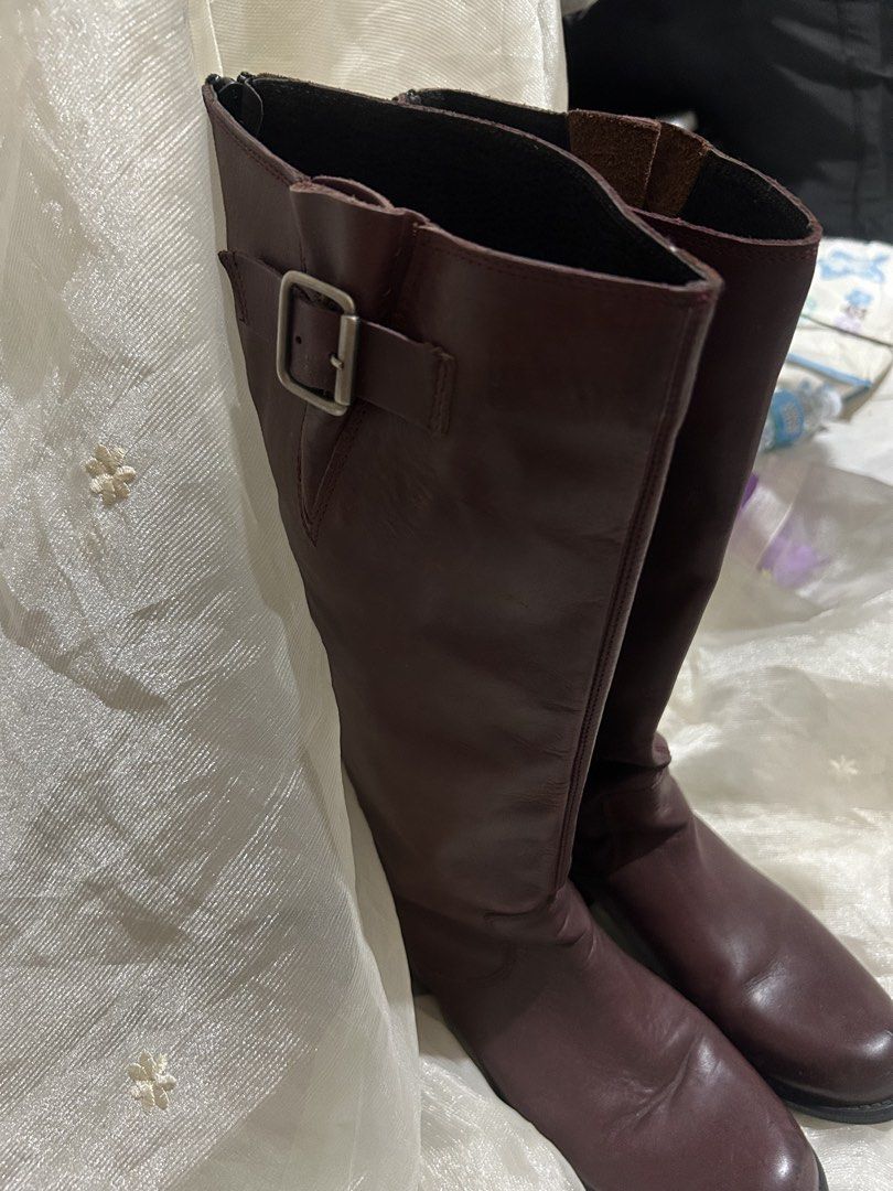 Steve Madden TRROTT Leather Knee-High Boots (Category: Boots) located in Tuguegarao City. Submitted by eliwyxzs (Listing ID 1467705334, Image 2). Description: - Brand/Model: Steve Madden TRROTT Tall Boots - Color/Material: Deep Burgundy Genuine Leather Upper, Rubber Sole - Size: 9 - Origin: Made in Mexico - Closure & Details: Full zipper down the back for easy slip-on, side buckle accent near the top - Condition: Minor scuffs on the toe area from