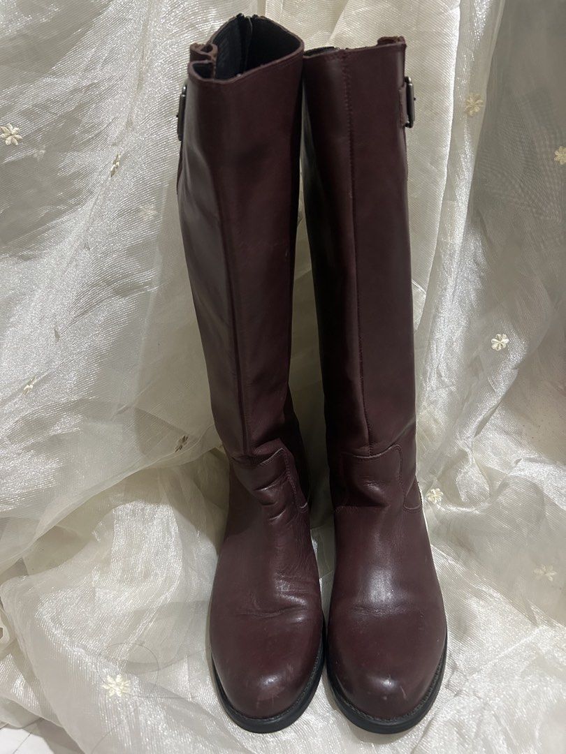 Steve Madden TRROTT Leather Knee-High Boots (Category: Boots) located in Tuguegarao City. Submitted by eliwyxzs (Listing ID 1467705334, Image 1). Description: - Brand/Model: Steve Madden TRROTT Tall Boots - Color/Material: Deep Burgundy Genuine Leather Upper, Rubber Sole - Size: 9 - Origin: Made in Mexico - Closure & Details: Full zipper down the back for easy slip-on, side buckle accent near the top - Condition: Minor scuffs on the toe area from