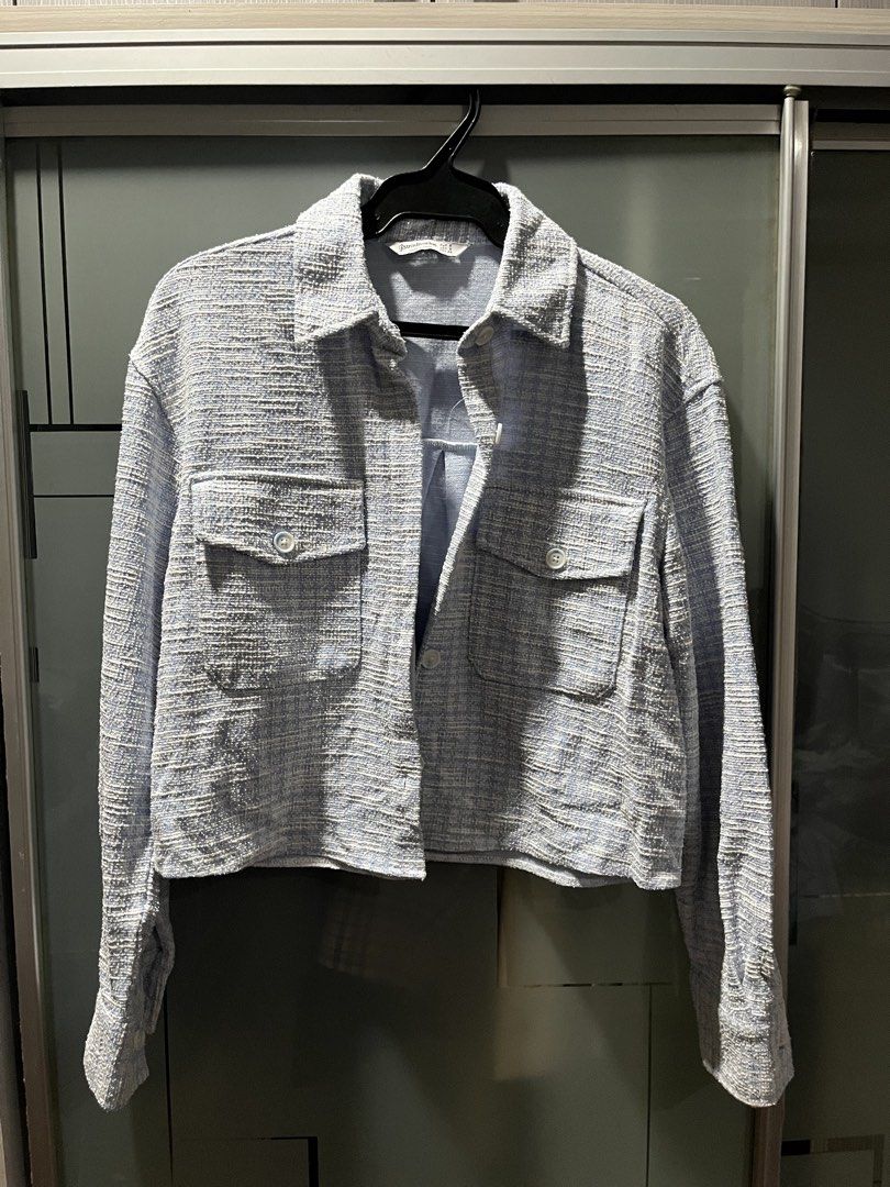 Stradivarius Blue and White Tweed Jacket (Category: Coats, Jackets and Outerwear) located in Makati City. Submitted by grizzlybear95 (Listing ID 1467734420, Image 1). Description: - Brand: Stradivarius - Size: S - Color: Light blue and white - Style: Cropped tweed jacket with classic collar and button-down front - Details: Two front chest pockets with button flaps, structured textured fabric - Condition: Great layering piece for cooler weather.
