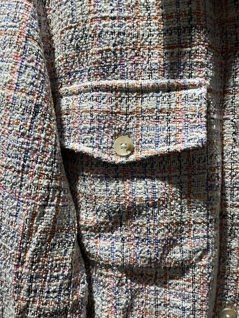 Stradivarius Tweed Crop Jacket Multicolour Size S (Category: Coats, Jackets and Outerwear) located in Makati City. Submitted by grizzlybear95 (Listing ID 1467734350, Image 3). Description: - Brand: Stradivarius - Style: Multicolour plaid tweed jacket with cropped fit - Color: White base woven with pink, orange, blue, and black threads - Details: Button-up front, classic collar, and two chest pockets with button flaps - Interior: Contrasting purpl