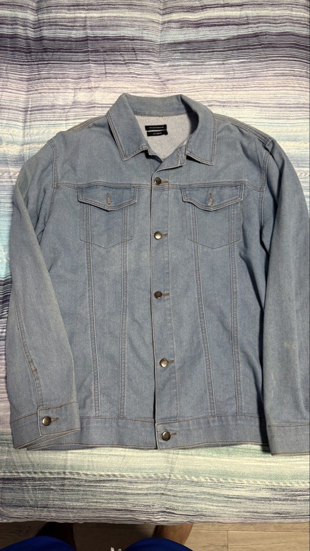 Straightforward Light Blue Denim Jacket XL (Category: Coats, Jackets and Outerwear) located in Quezon City. Submitted by kobeeeee_12 (Listing ID 1467640788, Image 1). Description: - Color: Light blue - Size: X-Large - Material: Durable denim - Design: Classic button-up front, collar, and chest flap pockets - Style: Versatile and easy to pair with casual everyday outfits.
