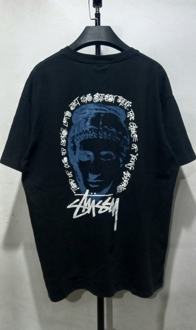 Stüssy Black Graphic Tee Size L (Category: Tshirts & Polo Shirts ) located in Tarlac. Submitted by den420 (Listing ID 1467740980, Image 1). Description: - Brand: Stüssy - Color: Black - Size: L (Made in Mexico) - Material: 100% Cotton - Design: Classic logo on left chest, large artistic face graphic and lettering on the back - Fit: Crew neck, short sleeves - Condition: Excellent streetwear find, ready to wear.