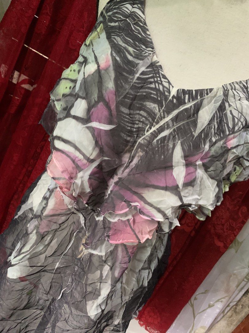 studio y butterfly print ruffle sleeveless top (Category: Sleeveless) located in Cebu City. Submitted by selamethrift (Listing ID 1467770107, Image 2). Description: - Brand: Studio Y - Size: med-large - Design: Abstract butterfly pattern in grey, pink, and white - Details: V-neckline with layered front ruffles - Fabric: Lightweight, crinkled texture - Origin: Made in Vietnam .