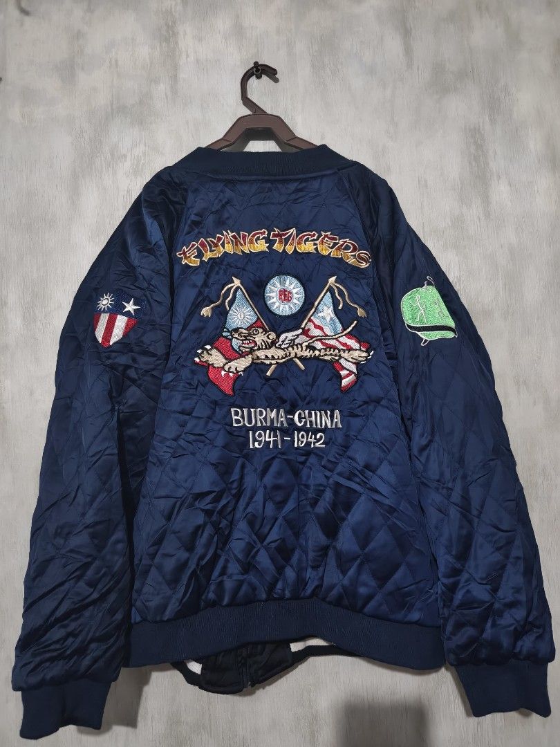 SUKAJAN Vintage Flying Tigers Regroup Mighty Eighth Reversible Bomber Jacket (Category: Coats, Jackets and Outerwear) located in Baguio. Submitted by fordaluvofthrift2600 (Listing ID 1466168343, Image 2). Description: vintage flying tigers Reversible bomber jacket with military-themed embroidery. One side features blue quilted satin with Flying Tigers patches and flags. Reverse side has black and white striped details, Mighty Eighth graphics, and