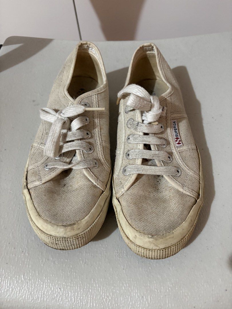 Superga 2750 Bundle: White Leather Strap EU 36 + White Classic Canvas EU 37 (Category: Sneakers) located in Muntinlupa City. Submitted by sukimum (Listing ID 1467622745, Image 3). Description: Both bought in 2021, used less than 10x each and not for long periods. Only kept in storage through the years hence the yellowing and dust. Both pairs need cleaning; the canvas one could also use a bit of regluing for the sole edges but the laces are practi
