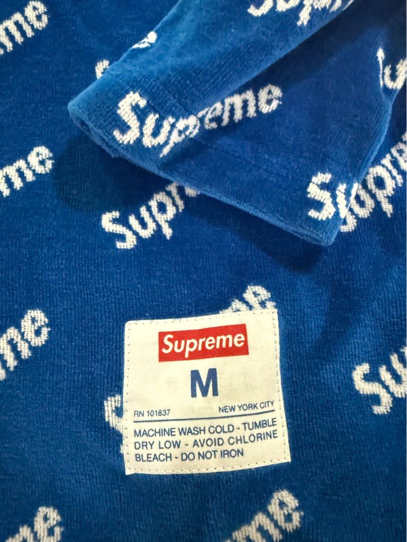 Supreme All-Over Print Blue Sweater Size M (Category: Coats, Jackets and Outerwear) located in Angono. Submitted by marketplacesellerph610 (Listing ID 1467719669, Image 2). Description: Authentic - Brand: Supreme - Color: Royal Blue with all-over white logo print - Size: Medium (tag on collar and wash label intact) - Material: Soft terry fleece - Design: Long sleeves, crew neck 1500.