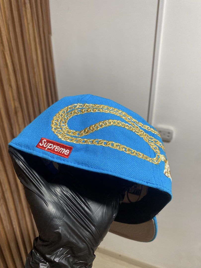 Supreme New Era 59FIFTY Blue S Logo Fitted Hat (Category: Caps & Hats) located in Caloocan City. Submitted by heatedcaps4425 (Listing ID 1467802802, Image 3). Description: - Brand: Supreme (Cooperstown Collection) - Style: Fitted cap with flat brim and grey under visor - Size: 7 1/2 - Color: Bright blue - Details: Large white S logo, gold chain embroidery, and red Supreme box logo patch - Condition: Brand new, never worn, with original New Era 59