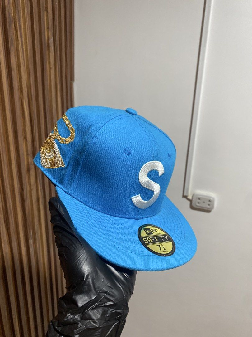 Supreme New Era 59FIFTY Blue S Logo Fitted Hat (Category: Caps & Hats) located in Caloocan City. Submitted by heatedcaps4425 (Listing ID 1467802802, Image 2). Description: - Brand: Supreme (Cooperstown Collection) - Style: Fitted cap with flat brim and grey under visor - Size: 7 1/2 - Color: Bright blue - Details: Large white S logo, gold chain embroidery, and red Supreme box logo patch - Condition: Brand new, never worn, with original New Era 59