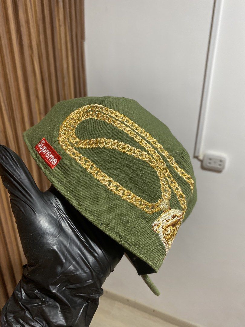 Supreme New Era 59FIFTY Green Cap Size 7 (Category: Caps & Hats) located in Caloocan City. Submitted by heatedcaps4425 (Listing ID 1467802776, Image 3). Description: - Brand: Supreme x New Era 59FIFTY - Color: Green with grey undervisor - Size: 7 (55.8 cm) - Details: White 'S' logo on front, intricate gold chain embroidery wrap, and red Supreme box logo on the back - Condition: Brand new with gold brim sticker and original inside taping/tags inta