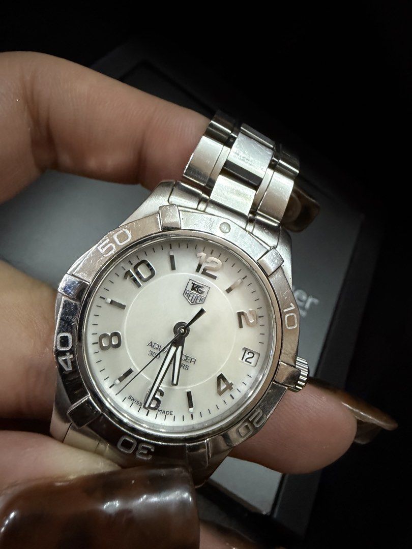 TAG Heuer Aquaracer 300M (Category: Luxury Watches) located in Manila. Submitted by paupreloveditems88 (Listing ID 1467701046, Image 3). Description: - Brand: TAG Heuer Aquaracer - Dial: White dial with bold Arabic numerals - Material: Stainless steel case and bracelet - Movement: Swiss quartz movement - Features: Rotating dive bezel, 300 meters water resistance - Inclusions: Original black TAG Heuer presentation box - Condition: Good working con
