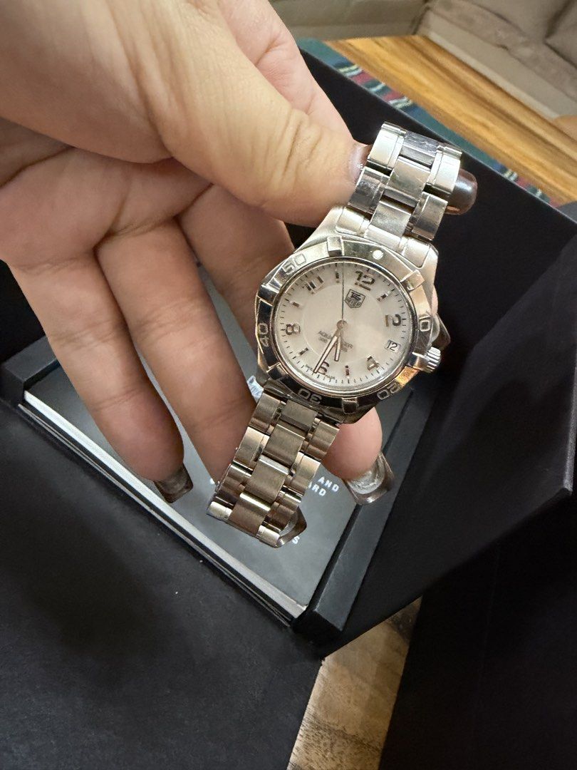 TAG Heuer Aquaracer 300M (Category: Luxury Watches) located in Manila. Submitted by paupreloveditems88 (Listing ID 1467701046, Image 2). Description: - Brand: TAG Heuer Aquaracer - Dial: White dial with bold Arabic numerals - Material: Stainless steel case and bracelet - Movement: Swiss quartz movement - Features: Rotating dive bezel, 300 meters water resistance - Inclusions: Original black TAG Heuer presentation box - Condition: Good working con