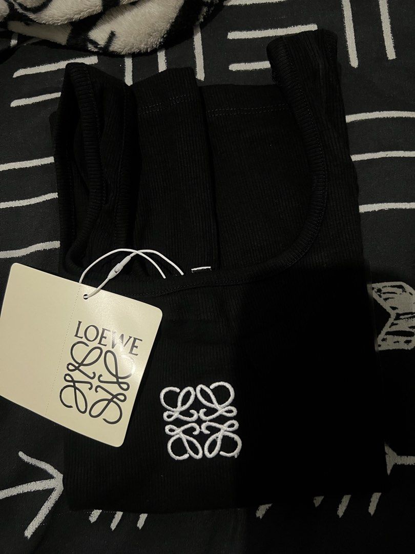 Tank Top (Category: Sleeveless) located in Manila. Submitted by chellerocker05 (Listing ID 1467605846, Image 2). Description: White & Black Color With Sizes S/M/L/XL.