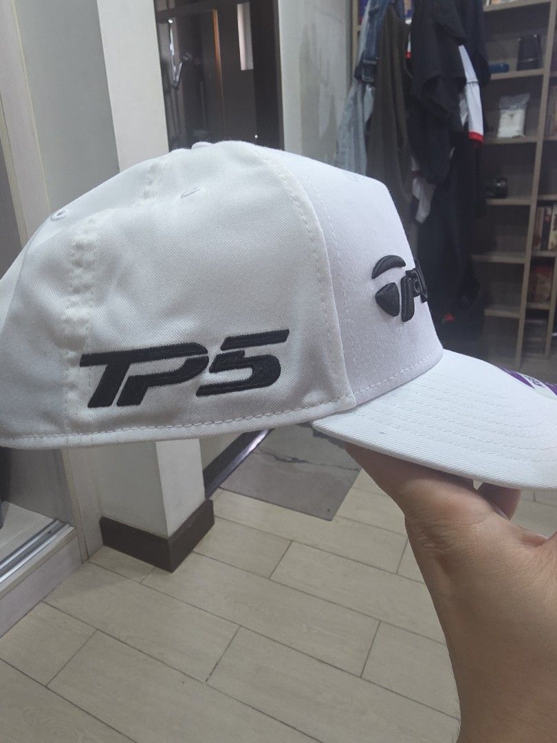 TaylorMade White A-Frame Golf Cap 58cm (Category: Caps & Hats) located in Manila. Submitted by read_description (Listing ID 1467655968, Image 3). Description: - Brand: TaylorMade - Color: Crisp white with bold black embroidered logo - Fit: A-frame structured fit, regular size 58cm - Closure: Adjustable strap at the back - Condition: Brand new with sticker still attached on the brim.