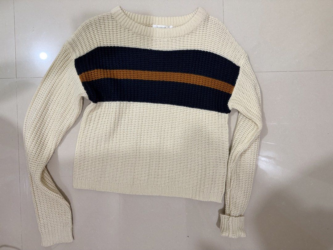 Terranova Striped Knit Sweater Size M (Category: Longsleeves) located in Kalibo. Submitted by goodfinds.club (Listing ID 1467754639, Image 1). Description: - Brand: Terranova - Size: Medium (tag on collar) - Colorway: Cream, navy blue, and brown stripes - Material/Texture: Cozy waffle knit - Design: Long sleeves and round neckline - Perfect for: Cooler weather, casual layering, and everyday wear.