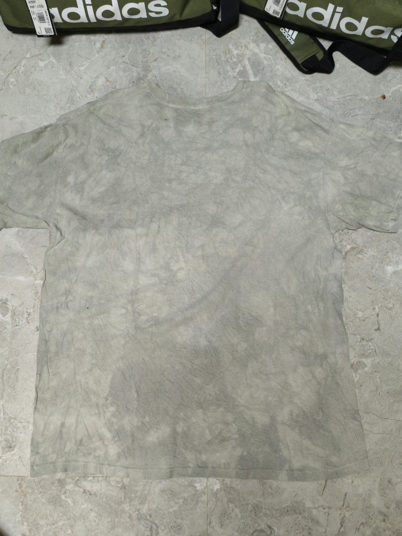 The Mountain Rhino Graphic Tee Size XL (Category: Tshirts & Polo Shirts ) located in Caloocan City. Submitted by delatorreg27719 (Listing ID 1467792048, Image 3). Description: - Brand: The Mountain - Design: Rhinoceros art print by Dimitar Neshev (Dated 2017) - Colorway: Tie-dye grey - Size: XL (Standard fit) - Material: 100% Cotton - Origin: Printed in USA, manufactured in Mexico - Condition: Normal wear consistent with regular use - Features: C
