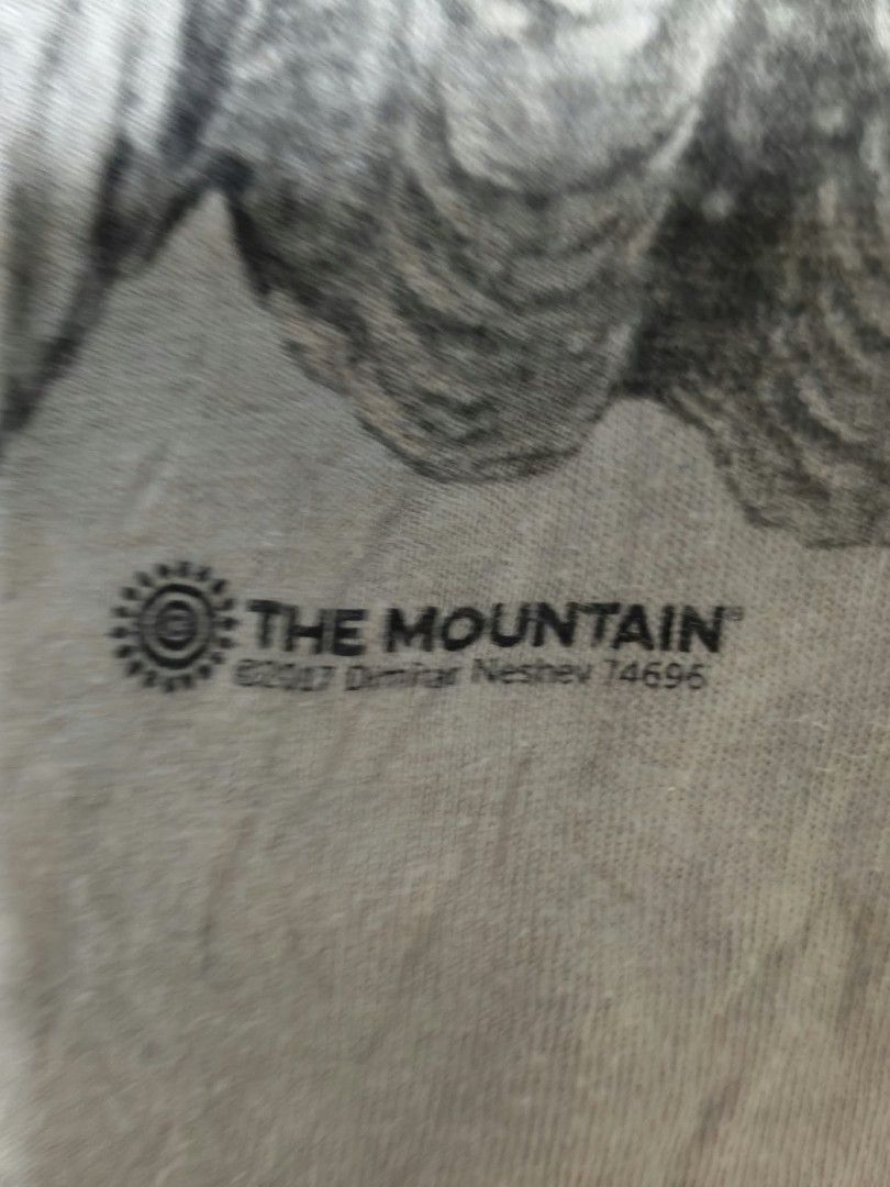 The Mountain Rhino Graphic Tee Size XL (Category: Tshirts & Polo Shirts ) located in Caloocan City. Submitted by delatorreg27719 (Listing ID 1467792048, Image 2). Description: - Brand: The Mountain - Design: Rhinoceros art print by Dimitar Neshev (Dated 2017) - Colorway: Tie-dye grey - Size: XL (Standard fit) - Material: 100% Cotton - Origin: Printed in USA, manufactured in Mexico - Condition: Normal wear consistent with regular use - Features: C
