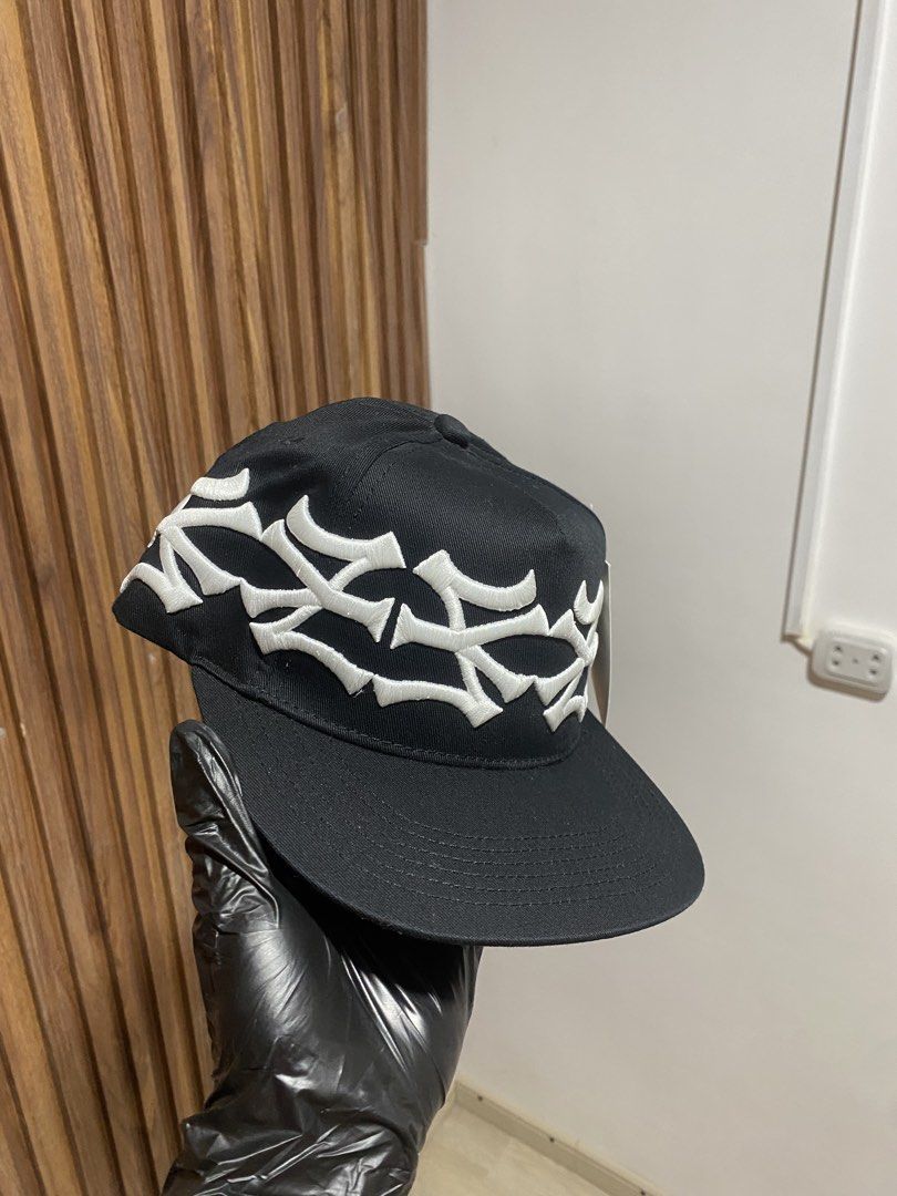 THE MUSEUM VISITOR Black Snapback Cap (Category: Caps & Hats) located in Caloocan City. Submitted by heatedcaps4425 (Listing ID 1467801701, Image 1). Description: - Brand: THE MUSEUM VISITOR - Style: Black snapback hat with clean structured fit - Design: White embroidered gothic crown graphics wrapping around the crown - Material: 100% cotton fabric - Fit: Adjustable snapback closure - Condition: Brand new with original paper hang tag attached - 