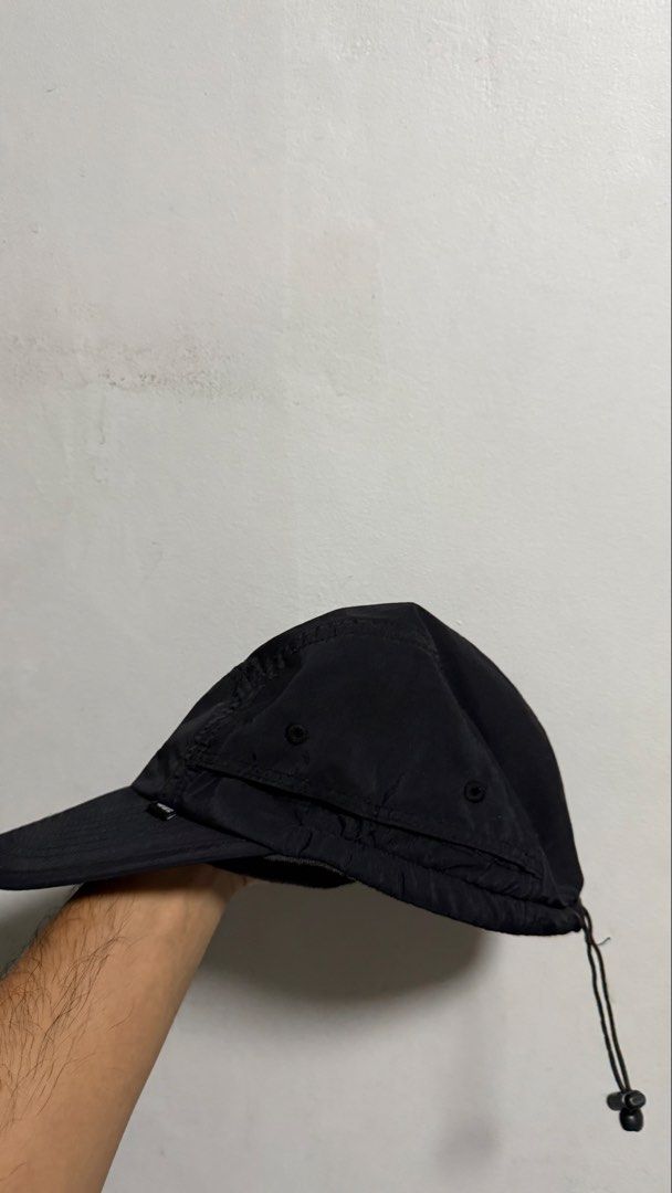 The North Face Black Nylon Cap Hat (Category: Caps & Hats) located in Quezon City. Submitted by kobeeeee_12 (Listing ID 1467738822, Image 3). Description: - Brand: The North Face - Color: Classic black nylon - Details: Embroidered white logo on front and back - Fit: Adjustable bungee cord toggle at the back - Comfort: Built-in internal sweatband - Feature: Lightweight and packable design - Condition: Clean all around - issue:can’t adjust because 