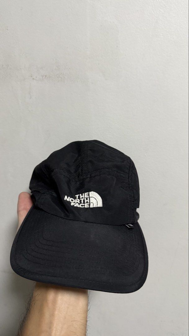 The North Face Black Nylon Cap Hat (Category: Caps & Hats) located in Quezon City. Submitted by kobeeeee_12 (Listing ID 1467738822, Image 1). Description: - Brand: The North Face - Color: Classic black nylon - Details: Embroidered white logo on front and back - Fit: Adjustable bungee cord toggle at the back - Comfort: Built-in internal sweatband - Feature: Lightweight and packable design - Condition: Clean all around - issue:can’t adjust because 