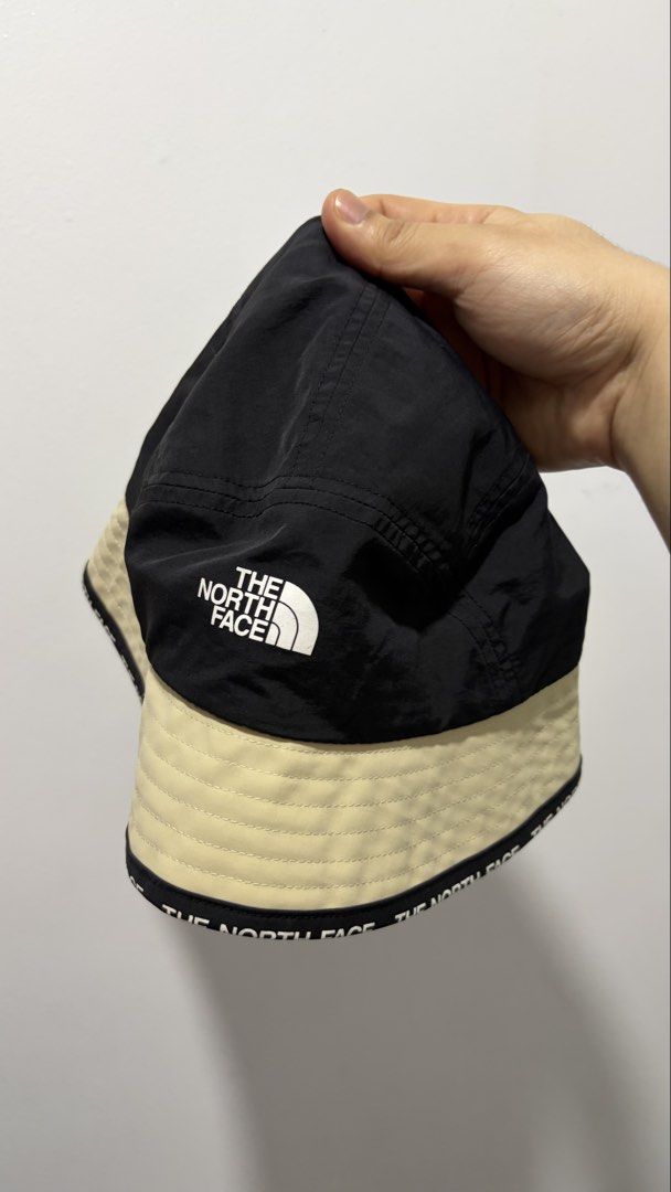 The North Face bucket hat (black/sand, Large) (Category: Hats & Beanies) located in Quezon City. Submitted by sefdeclutters (Listing ID 1467662214, Image 3). Description: FOR SALE: ITEM: The North Face Bucket Hat (black/sand) CONDITION: 10/10 PRICE: ^price (negotiable for buyers who can get this asap) RFS: gifted to me, but I am not a bucket hat guy :(.