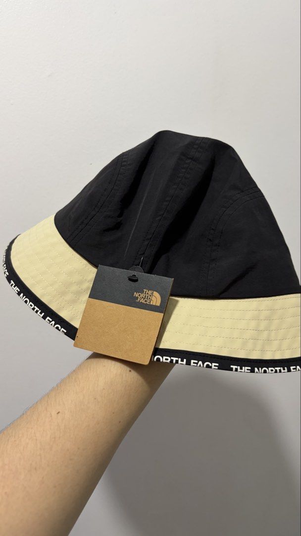 The North Face bucket hat (black/sand, Large) (Category: Hats & Beanies) located in Quezon City. Submitted by sefdeclutters (Listing ID 1467662214, Image 2). Description: FOR SALE: ITEM: The North Face Bucket Hat (black/sand) CONDITION: 10/10 PRICE: ^price (negotiable for buyers who can get this asap) RFS: gifted to me, but I am not a bucket hat guy :(.
