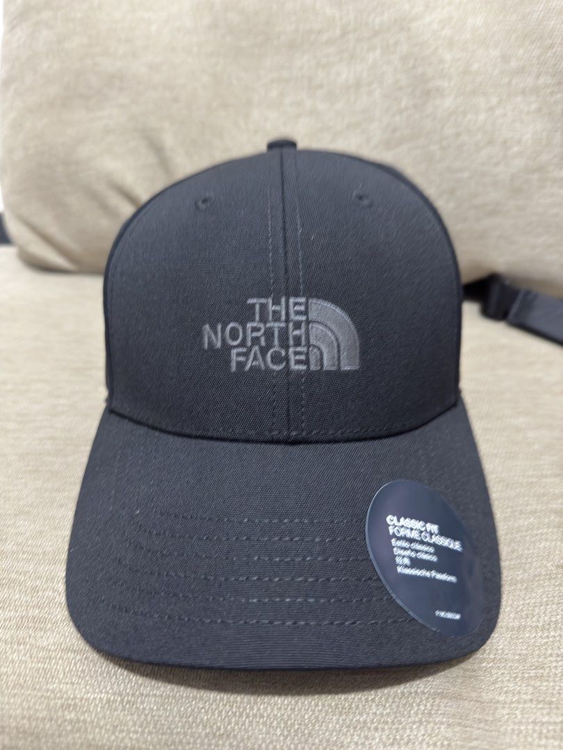 The North Face Classic Fit Black Cap (Category: Caps & Hats) located in Manila. Submitted by lucky_anton (Listing ID 1467768900, Image 3). Description: - Brand: The North Face - Color: Classic Black - Fit: Classic silhouette with adjustable strap and metallic buckle - Design: Embroidered tonal logo on the front - Condition: Brand new with paper store tags and original plastic packaging.