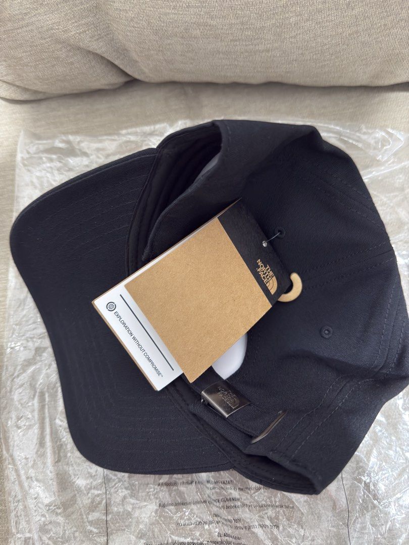 The North Face Classic Fit Black Cap (Category: Caps & Hats) located in Manila. Submitted by lucky_anton (Listing ID 1467768900, Image 1). Description: - Brand: The North Face - Color: Classic Black - Fit: Classic silhouette with adjustable strap and metallic buckle - Design: Embroidered tonal logo on the front - Condition: Brand new with paper store tags and original plastic packaging.