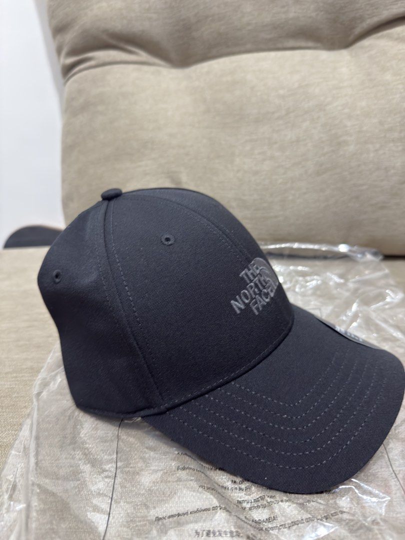 The North Face Classic Fit Black Cap (Category: Caps & Hats) located in Manila. Submitted by lucky_anton (Listing ID 1467768900, Image 2). Description: - Brand: The North Face - Color: Classic Black - Fit: Classic silhouette with adjustable strap and metallic buckle - Design: Embroidered tonal logo on the front - Condition: Brand new with paper store tags and original plastic packaging.