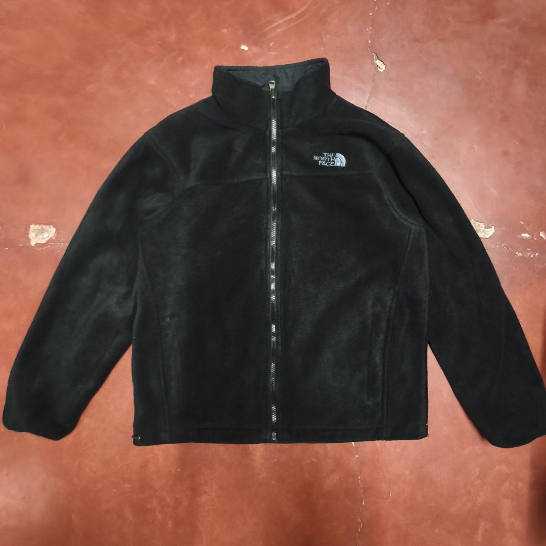 The North Face Reversible Black Jacket (Category: Coats, Jackets and Outerwear) located in Antipolo. Submitted by alphaomega_fox (Listing ID 1467705851, Image 3). Description: - Brand: The North Face - Color: Classic Black - Design: Reversible (Smooth fabric on one side, cozy fleece on the other) - Closure: Full front zip with high wind-blocking collar - Pockets: Secure zippered pockets on the smooth side - Fit: Adjustable hem with drawcords for 