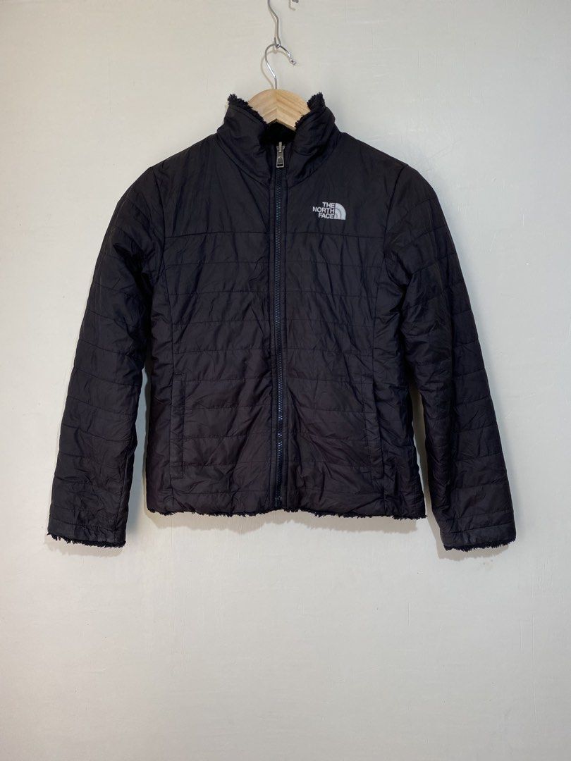 THE NORTH FACE,Reversible jacket (Category: Babies & Kids Fashion) located in Cavite. Submitted by jc_thrift95 (Listing ID 1467762947, Image 1). Description: - a black The North Face reversible youth or girls’ jacket, likely a Mossbud or similar insulated sherpa-fleece style. - Made in Indonesia - Reversible, Medium,girls 10-12 years old - L- 22 inch - W- 18 inch - Color rate 8/10 - See picture details for dimes. .