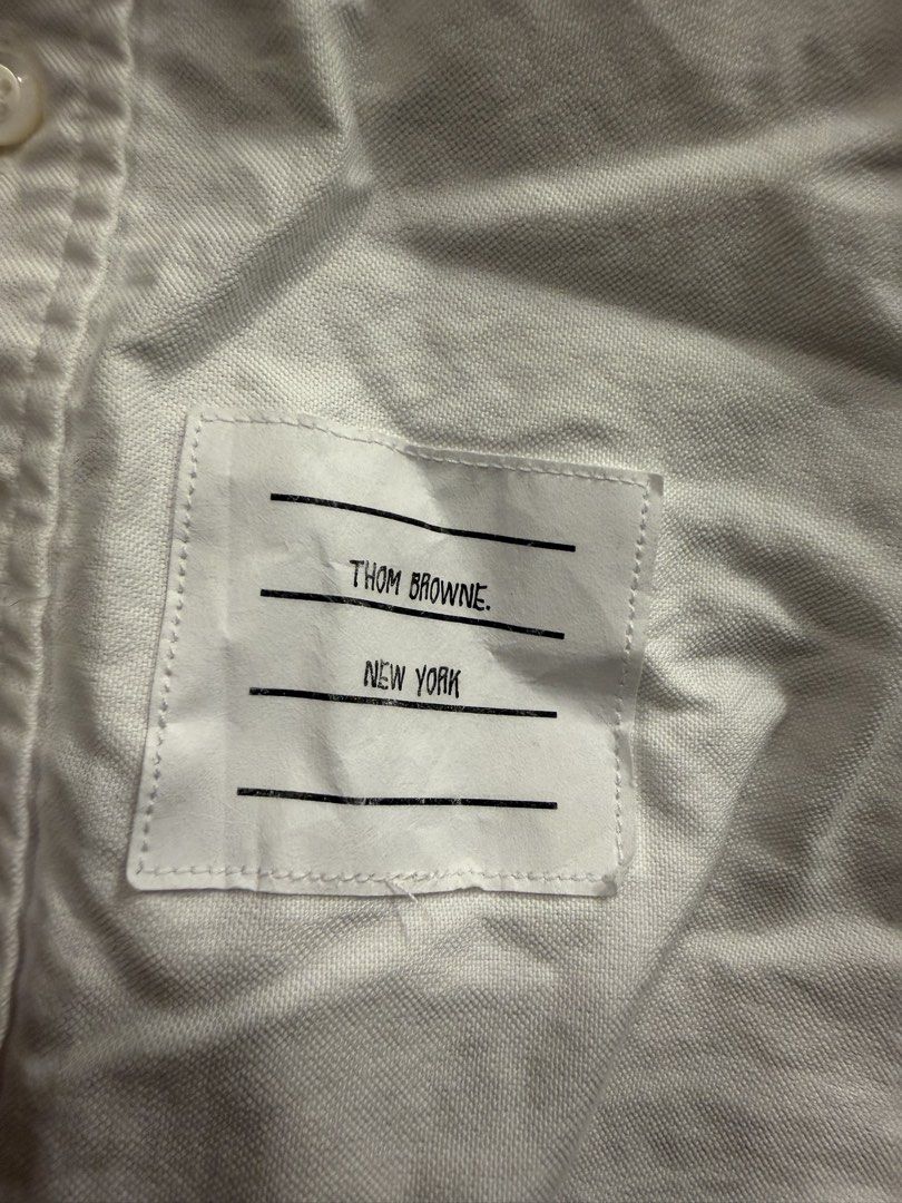 Thom browne (Category: Tshirts & Polo Shirts ) located in Quezon City. Submitted by macleen17 (Listing ID 1467663518, Image 3). Description: Thom browne Size 1 Dimes 19.5W/29L Issue Color stain in iconic Design Excellent Condition White color .