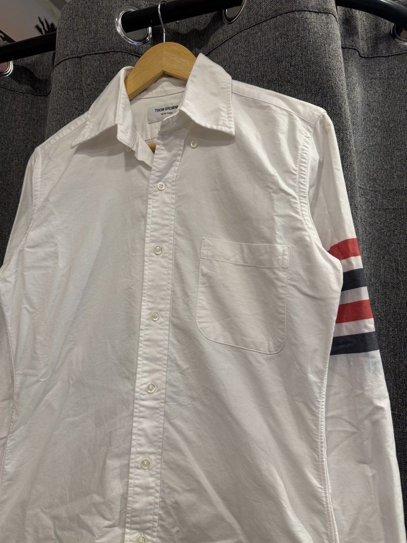 Thom browne (Category: Tshirts & Polo Shirts ) located in Quezon City. Submitted by macleen17 (Listing ID 1467663518, Image 2). Description: Thom browne Size 1 Dimes 19.5W/29L Issue Color stain in iconic Design Excellent Condition White color .