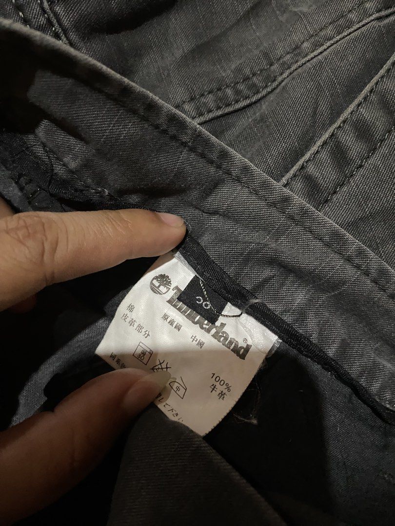 Timberland Dark Grey Casual Pants Size 30 (Category: Jeans) located in Manila. Submitted by coollion.19b40f (Listing ID 1467774588, Image 3). Description: - Brand: Timberland - Size: 30 - Color: Dark Grey - Material: 100% cotton canvas - Fit: Straight leg - Details: Classic button closure with branded button, waist tag, and subtle embroidered tree logo near the front pocket - Condition: Excellent - Perfect for casual, everyday wear.