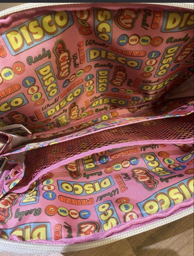 TinyTAN Dynamite Pouch (Category: K-Wave Merchandise) located in Marikina City. Submitted by culose (Listing ID 1467714951, Image 2). Description: - Authentic BTS TinyTAN Dynamite theme pouch - Features all 7 members (RM, Jin, Suga, j-hope, Jimin, V, Jungkook) in adorable chibi style - Vibrant pink interior lining with fun DISCO patterns - Convenient mesh divider pocket inside for better organization - Secure zip-top closure to keep your items sa