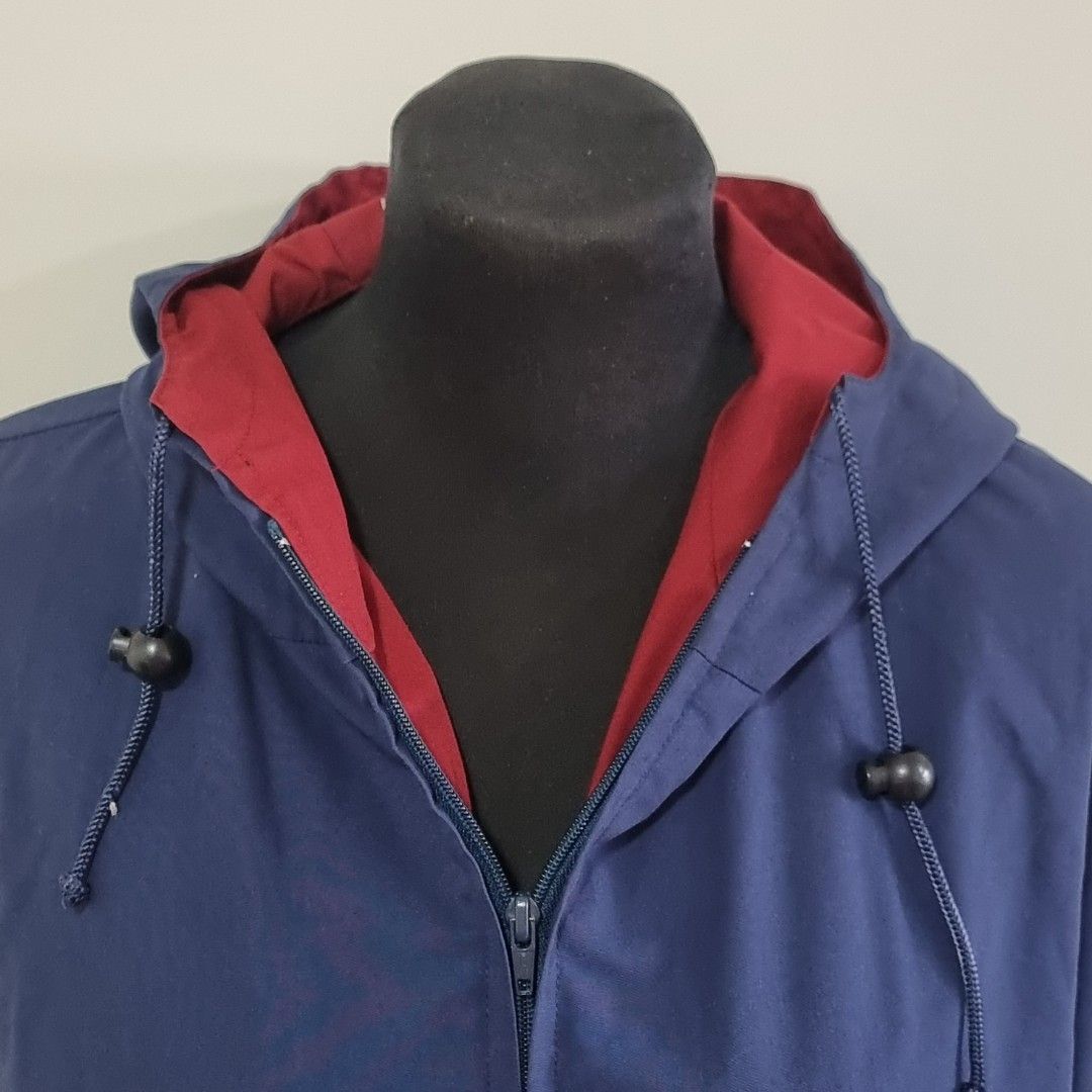 Tom Dick & Harry by Rustans Blue Hooded Jacket (Category: Coats, Jackets and Outerwear) located in Pasig City. Submitted by lesmitch (Listing ID 1467649195, Image 2). Description: - Brand: Tom Dick & Harry by Rustans - Color: Dark blue with contrasting red inner lining - Size: Medium (tag on collar) - Closure: Full front zip - Hood & Hem: Adjustable drawstrings for a customized fit - Pockets: Deep flap pockets on both sides - Cuffs: Secured with 