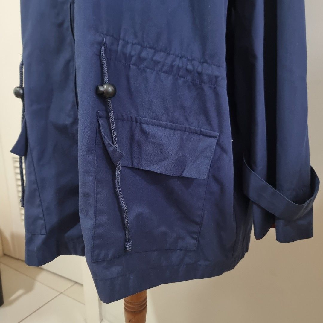 Tom Dick & Harry by Rustans Blue Hooded Jacket (Category: Coats, Jackets and Outerwear) located in Pasig City. Submitted by lesmitch (Listing ID 1467649195, Image 3). Description: - Brand: Tom Dick & Harry by Rustans - Color: Dark blue with contrasting red inner lining - Size: Medium (tag on collar) - Closure: Full front zip - Hood & Hem: Adjustable drawstrings for a customized fit - Pockets: Deep flap pockets on both sides - Cuffs: Secured with 