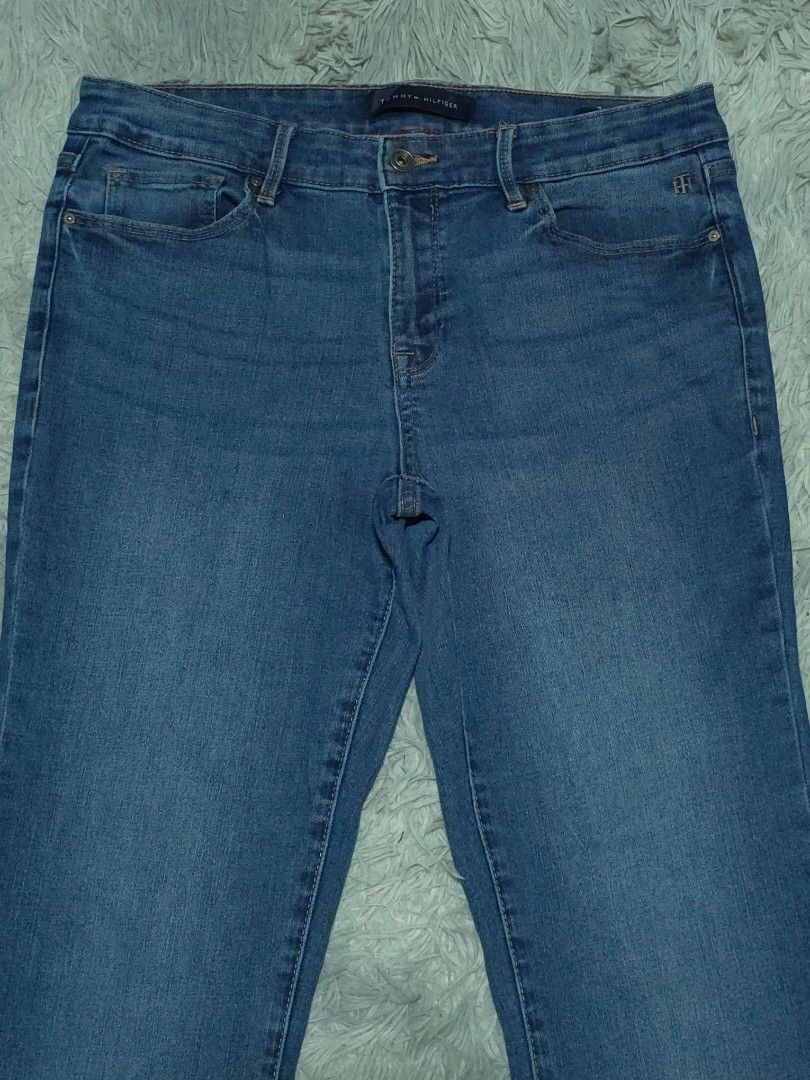 Tommy Hilfiger Blue Denim Jeans (Category: Jeans) located in Abulug. Submitted by humanwhosellthings (Listing ID 1467640235, Image 3). Description: - Brand: Tommy Hilfiger Denim Pants ✅Excellent Condition ✅Issue: needs wash ▫️Waist Size: 32 ▫️Length: 38 - Color/Wash: Medium blue - Fit: Straight leg, versatile casual wear - Design: Classic five-pocket style with button closure and zip fly - Details: Branded hardware and subtle flag logo accents - 