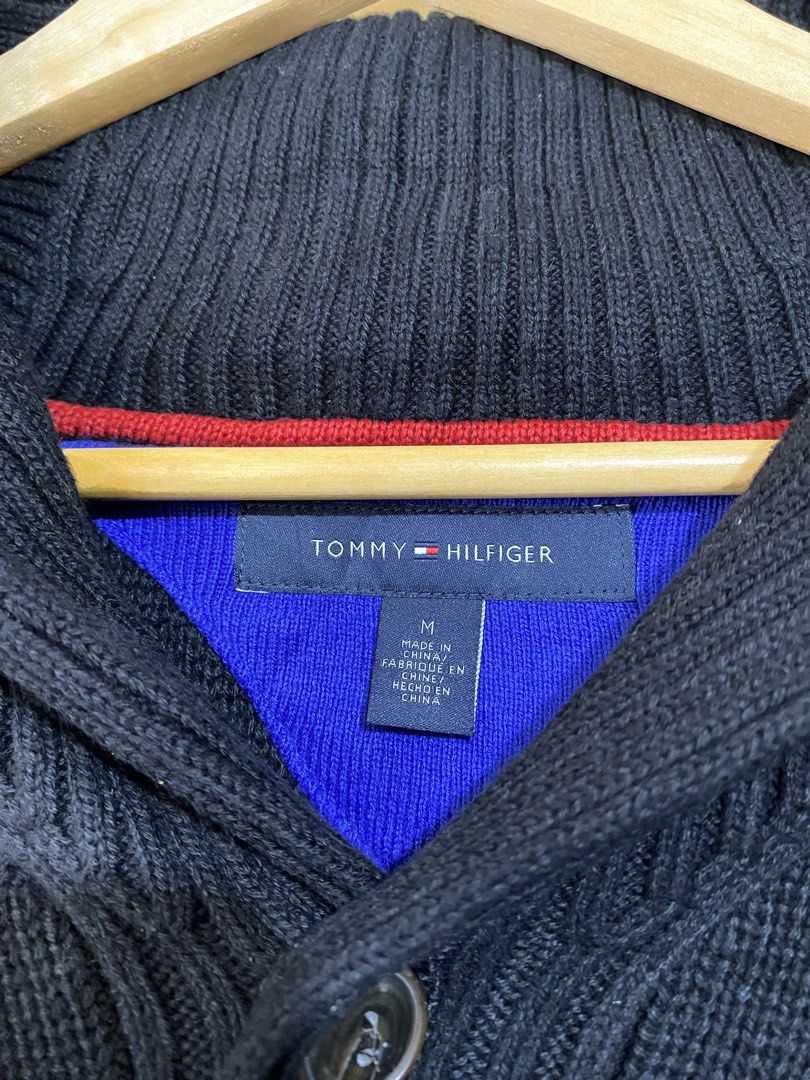 TOMMY HILFIGER,wide-neck pullover sweater (Category: Coats, Jackets and Outerwear) located in Cavite. Submitted by jc_thrift95 (Listing ID 1467779167, Image 3). Description: - This is a black Tommy Hilfiger men’s knit shawl-collar / wide-neck pullover sweater featuring a 1/4 button placket, ribbed cuffs and hem, and a small Tommy Hilfiger flag logo embroidery on the chest. - Medium - L- 27 inch - W- 24 inch - Color rate 8/10 (need wash) - See pic