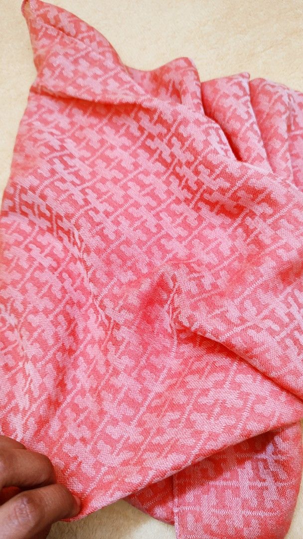 Tory Burch Monogram Scarf Coral Pink (Category: Scarves) located in Manila. Submitted by anez06 (Listing ID 1467613726, Image 3). Description: - Brand: Tory Burch - Color: Bright coral pink with all-over monogram pattern - Material: Soft viscose and modal blend (Made in Italy) - Features: Lightweight fabric, perfect for draping over coats or wearing on cooler days - Condition: Brand tag and care label attached.