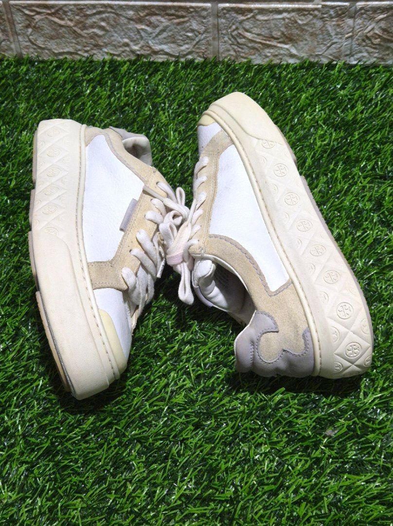 Tory Burch Sneakers White Beige Platform Size: 6.5 (Category: Sneakers) located in Antipolo. Submitted by saribymonica (Listing ID 1461254433, Image 1). Description: - White and beige Tory Burch platform sneakers - Features a lace-up closure - Embossed logo pattern on the platform sole - Minor scuffs on the soles and light creasing on the leather. Shoelace eyelet has a tear damage, as shown in photos..