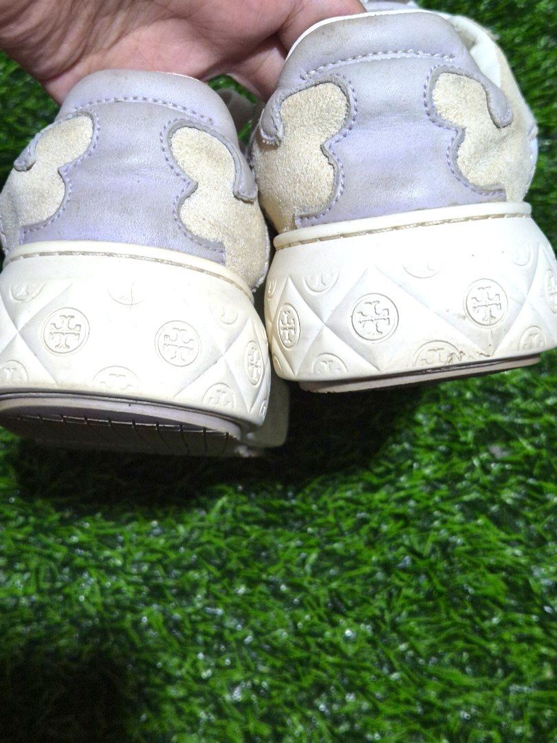 Tory Burch Sneakers White Beige Platform Size: 6.5 (Category: Sneakers) located in Antipolo. Submitted by saribymonica (Listing ID 1461254433, Image 3). Description: - White and beige Tory Burch platform sneakers - Features a lace-up closure - Embossed logo pattern on the platform sole - Minor scuffs on the soles and light creasing on the leather. Shoelace eyelet has a tear damage, as shown in photos..