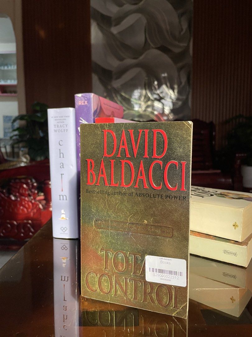 Total Control by David Baldacci Paperback Novel (Category: Storybooks) located in Muntinlupa City. Submitted by sabelle.ylc (Listing ID 1467729010, Image 1). Description: - Title: Total Control by David Baldacci - Genre: Suspense and political thriller - Condition: Pre-loved with minor edge wear, surface creases, and a thrift store sticker on the front cover; all pages intact - Cover: Striking gold and red design .